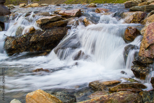 Long exposure picture of a small cold waterfalls through boulders in Snowdonia  Wales