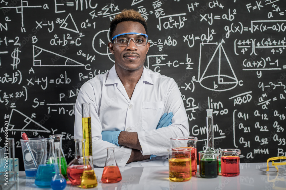 Scientists wear glasses and folded arms in the laboratory. Scientists wear glasses and folded arms in the laboratory.