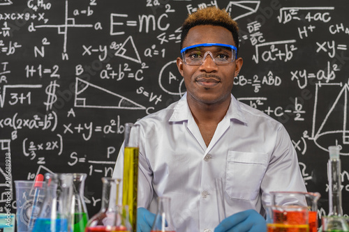 Scientists wear glasses and sit in the laboratory.