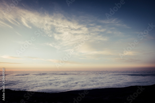 Sky and clouds beautiful rare landscape - blue colors and horizon - beauty of outdoor nature - fly and travel concept - sunset or sunrise time and. natural coloured background at the mountain