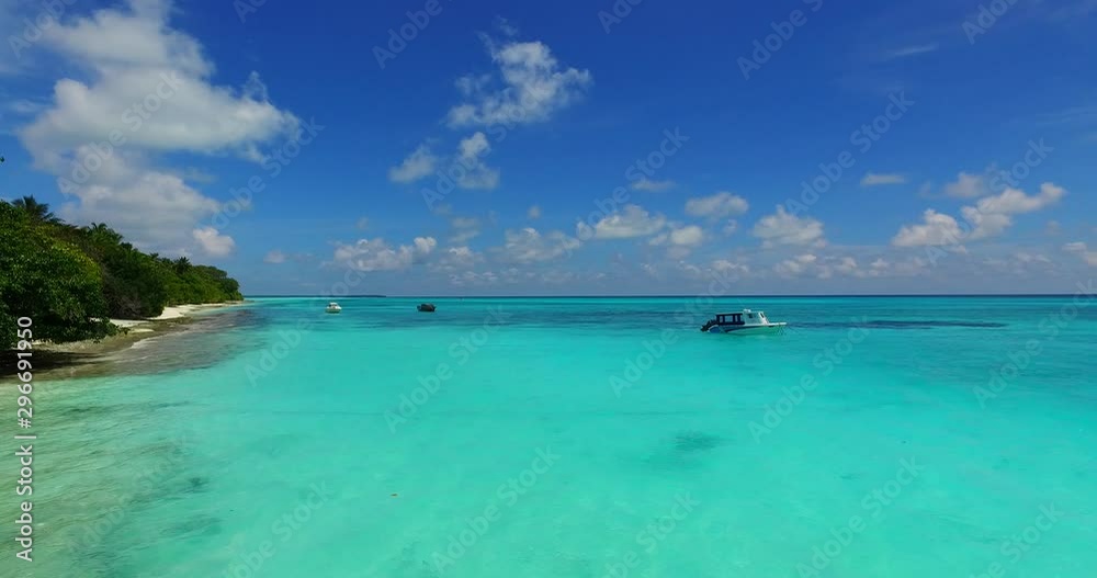 Aerial view of the boat sailing through the tropical sea Aerial view of the boat sailing through the tropical sea