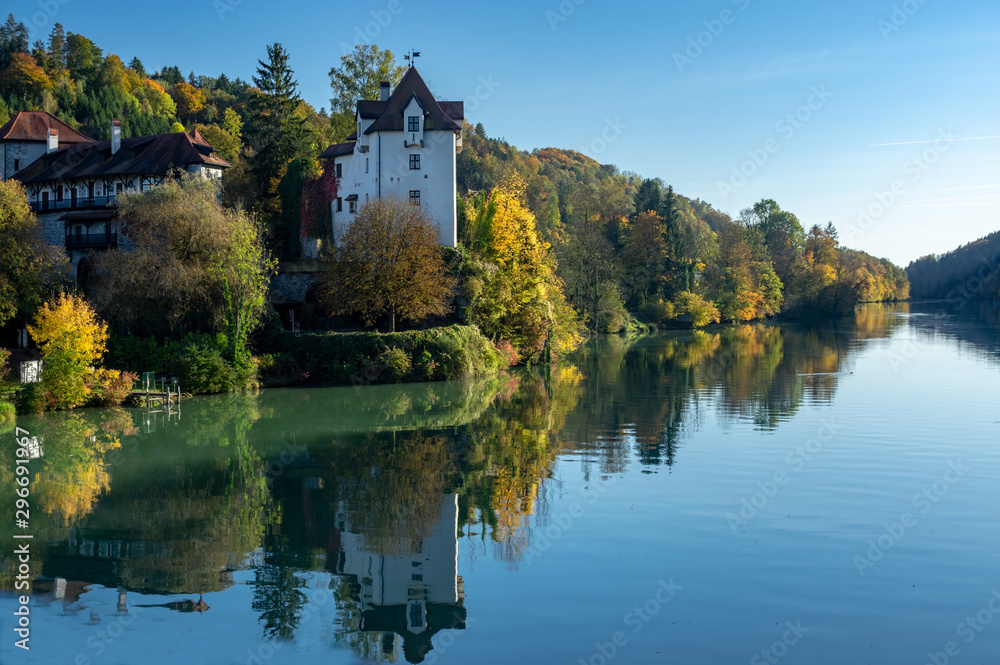 old castel at the river in autumn blue sky