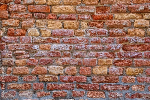 Fényképezés Red brick wall with saltpeter and moisture.