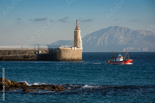 Billede på lærred A traditional fishing ship leaving the port of Tarifa, Cadiz province, Andalusia