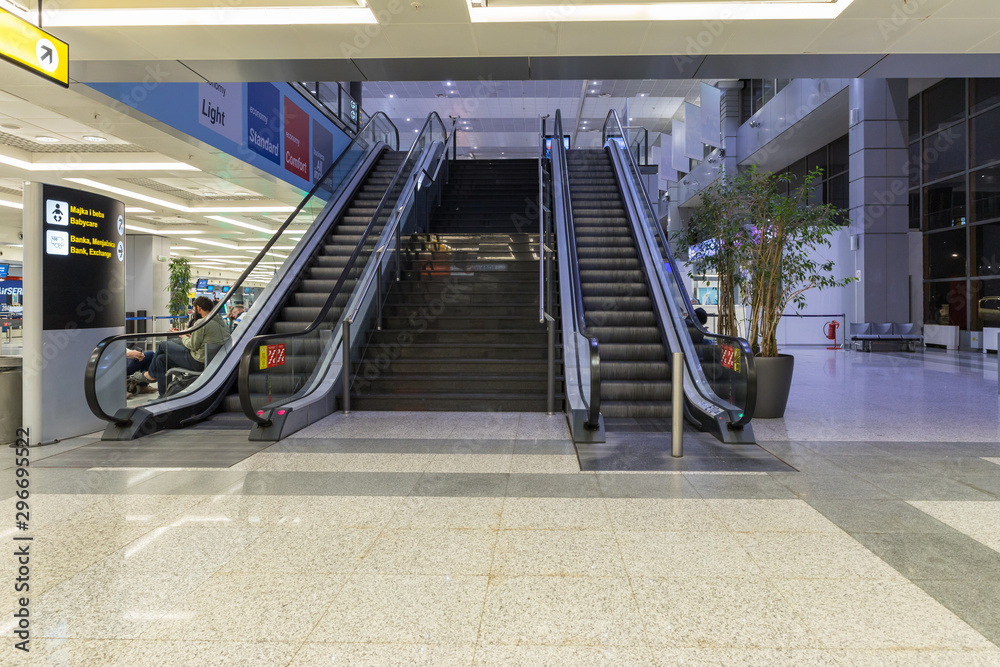 Escalator leading to the upper floor in the check-in lounge at the Nikola  Tesla International Airport near the city of Belgrade in Serbia Stock-Foto  | Adobe Stock
