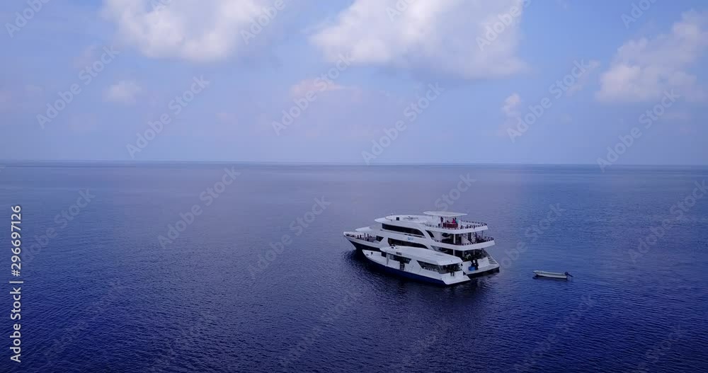 Yacht and the small boat floating in the deep seawater. aerial drone dolly out shot expencive Yacht and the small boat floating in the deep seawater. aerial drone dolly out shot expencive