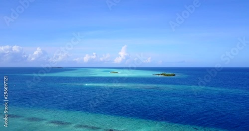 breathtaking view of tropical uninhabited desert island in the crystal clear waters of Philippine sea, coral reef and sandbanks,aerial drone pedestal up shot photo