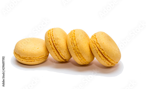 composition of yellow almond cookies on a white background
