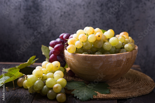 Healthy fruits Red and White wine grapes on stone backgrounds