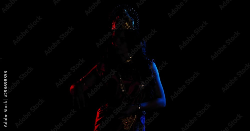 Indian goddess Lakshmi is dancing in low lighting, red and blue, 4k Indian goddess Lakshmi is dancing in low lighting, red and blue, 4k