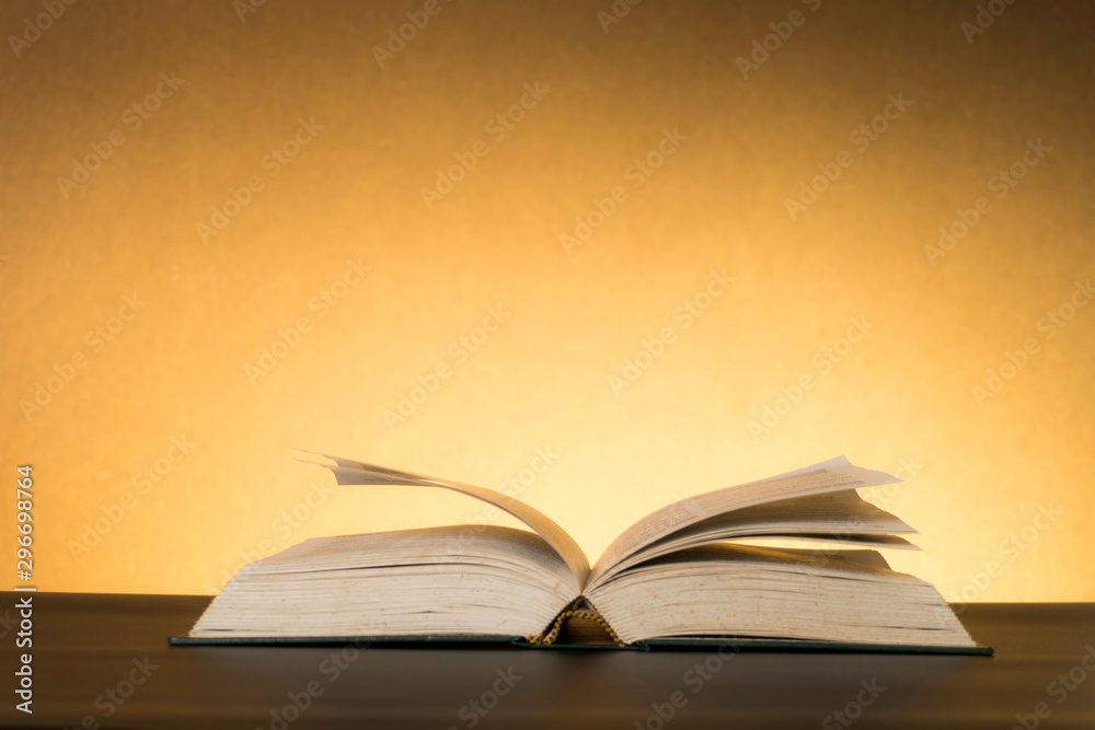 Obraz premium Symbolic hard study is powerful to succeed, concept with book and alarm clock. Time in business and quality