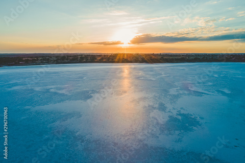 Sunrise shining on beautiful salt textures on lake surface in Australian Desert