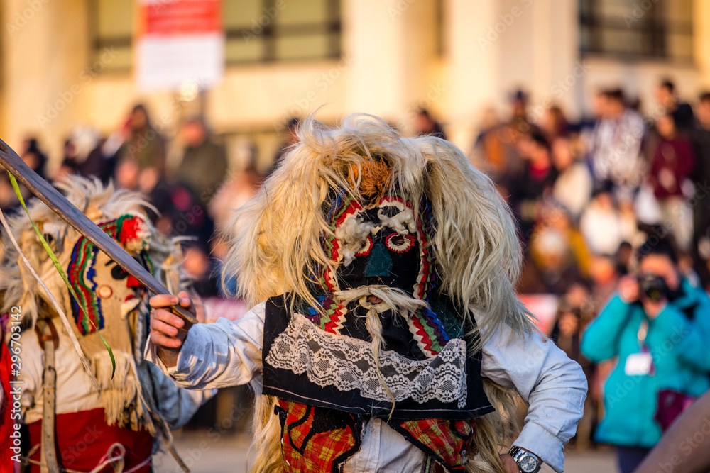 Mummers perform rituals to scare evil spirits at Surva festival at Pernik in Bulgaria. The people with the masks are called Kuker (kukeri). Mask from wool .