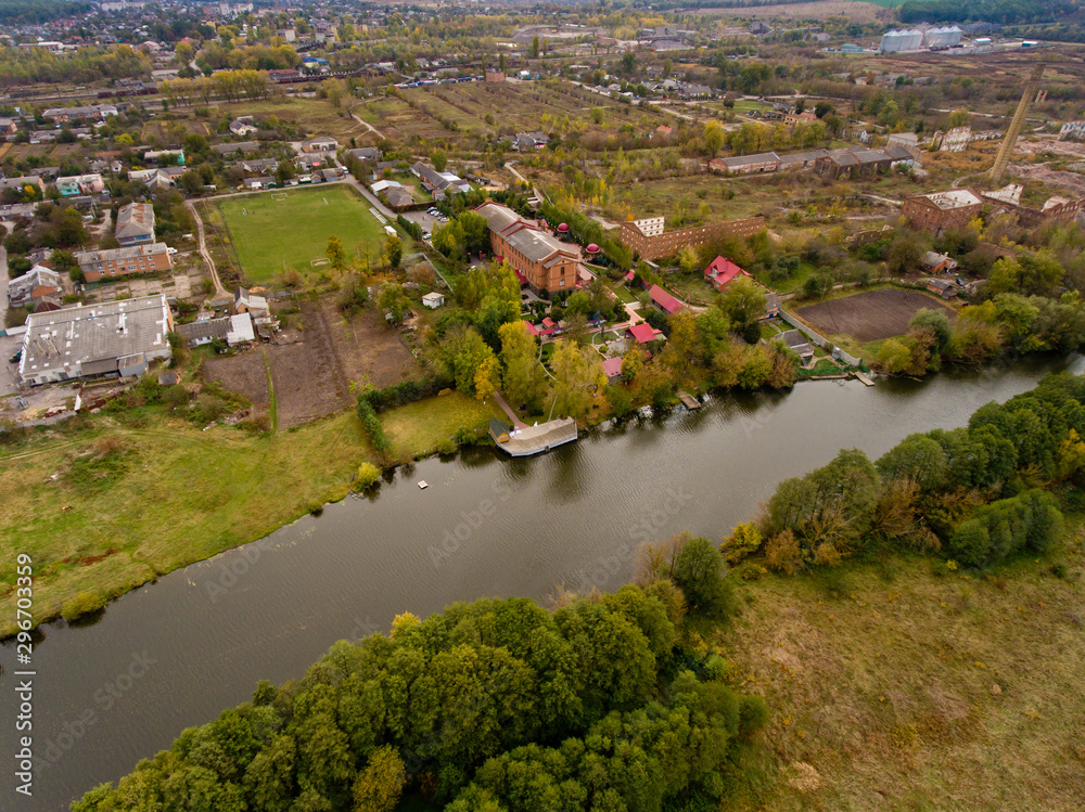 European village, river, forest. Aerial view.