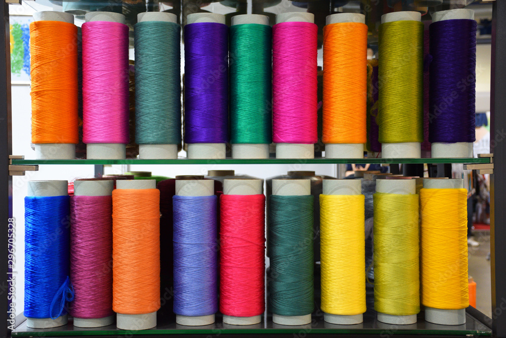 Large colorful polypropylene threads set in rainbow mood. Multicolored bobbin thread. Polypropylene multifilament yarns. Set of sewing thread coils, miscellaneous colours. Large colorful polypropylene threads set in rainbow mood. Multicolored bobbin thread. Polypropylene multifilament yarns. Set of sewing thread coils, miscellaneous colours.