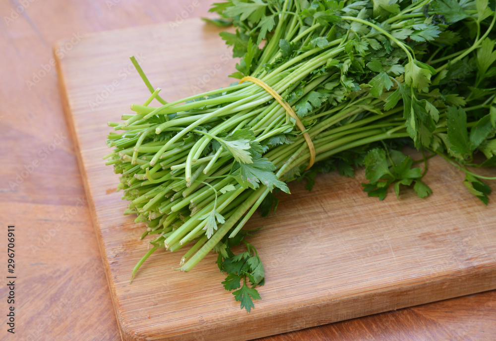 fresh parsley on a wooden board fresh parsley on a wooden board