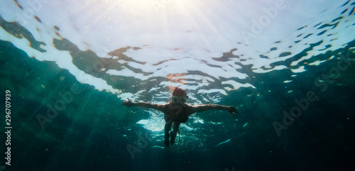 Underwater photo of woman snorkeling in the sea