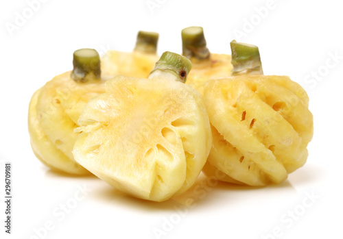 Ripe pineapple peeled on white background