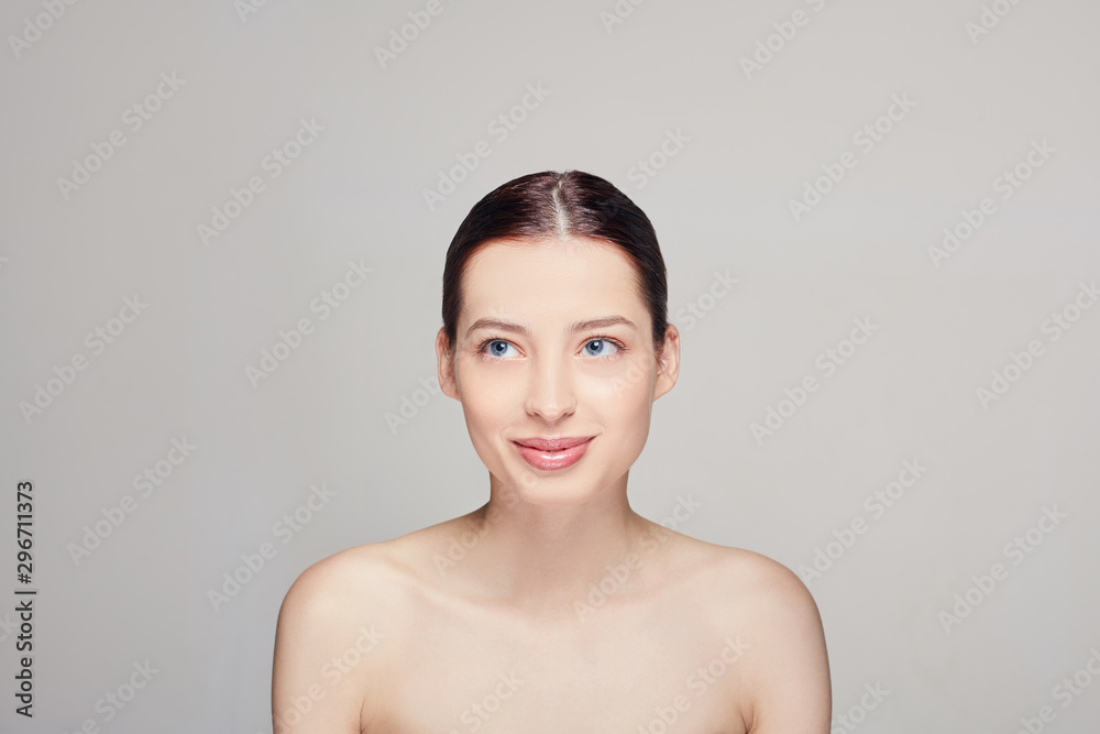 Beautiful girl with natural makeup. Women with clean fresh skin, dark hear and blue eyes. Closeup. Cosmetology. Skincare. Spa. Beautiful girl with natural makeup. Women with clean fresh skin, dark hear and blue eyes. Closeup. Cosmetology. Skincare. Spa.