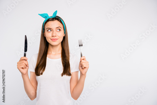 Close-up portrait of her she nice attractive lovely winsome girl holding in hands fork knife choosing healthy organic dieting day daily menu isolated over light white color background
