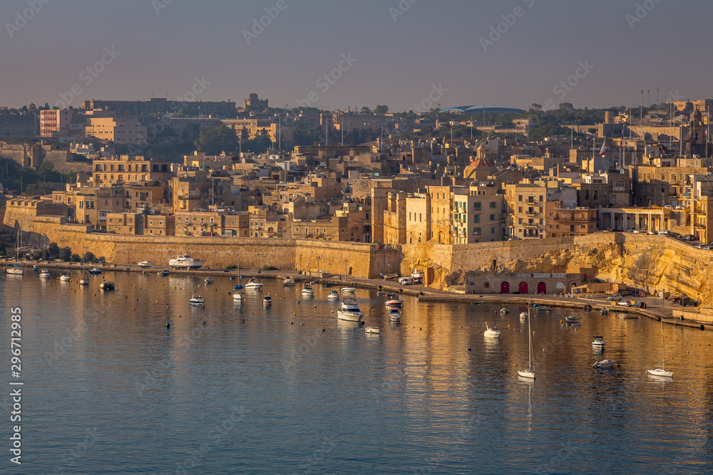 Valletta Panorama of the City Center and Fishing Boats. Beautiful aerial view of the Valletta city in Malta. Taken from a Ship this photo captures well the amazing architecture and charm of this city.