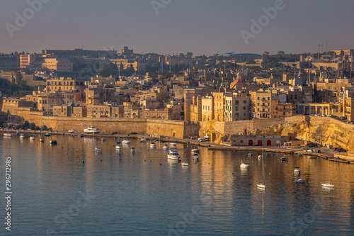 Valletta Panorama of the City Center and Fishing Boats. Beautiful aerial view of the Valletta city in Malta. Taken from a Ship this photo captures well the amazing architecture and charm of this city. © Paulo