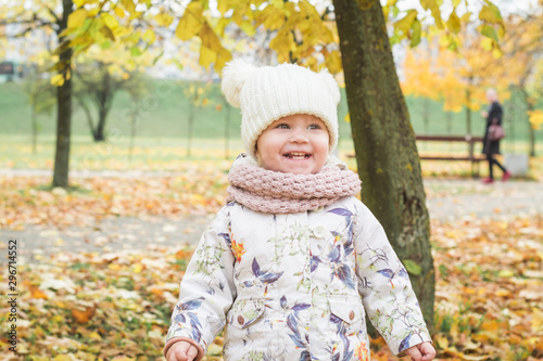 Beautiful little girl in the autumn park