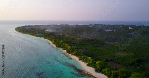 The burning stubble on malaysian island farm fields. Air polution and palm plantation photo