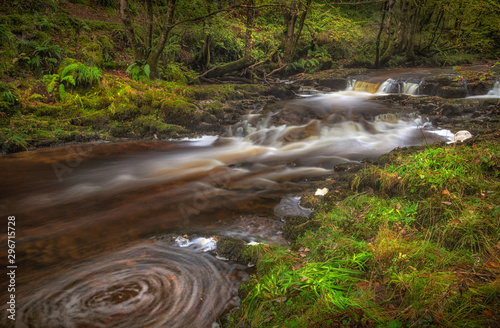 Long exposure of the Afon Pyrddin River on the way to Sgwd Gwladus waterfall in South Wales, UK photo