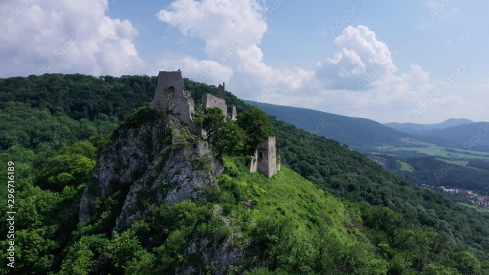 Flight close to abandoned medieval ruined Plavecky Castle on a rock, Slovakia. Flight close to abandoned medieval ruined Plavecky Castle on a rock, Slovakia.