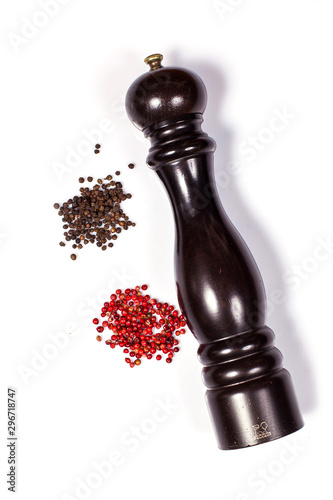 Pepper mill with black and red peppercorn isolated on white background