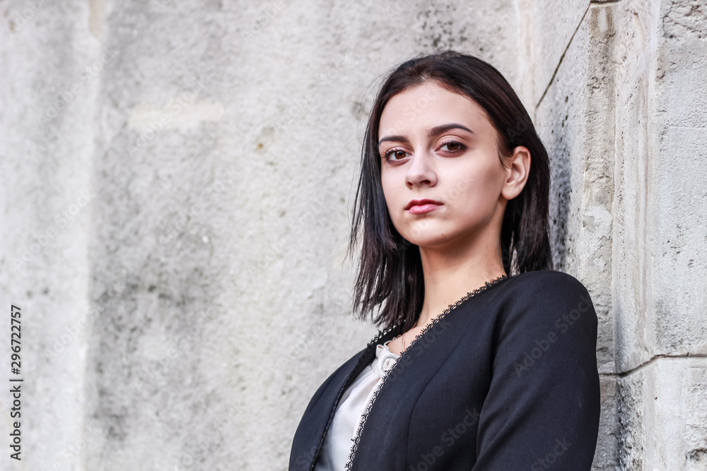 Black haired girl.Business woman in black classic suit.White blouse.Fashion style. Black haired girl.Business woman in black classic suit.White blouse.Fashion style.