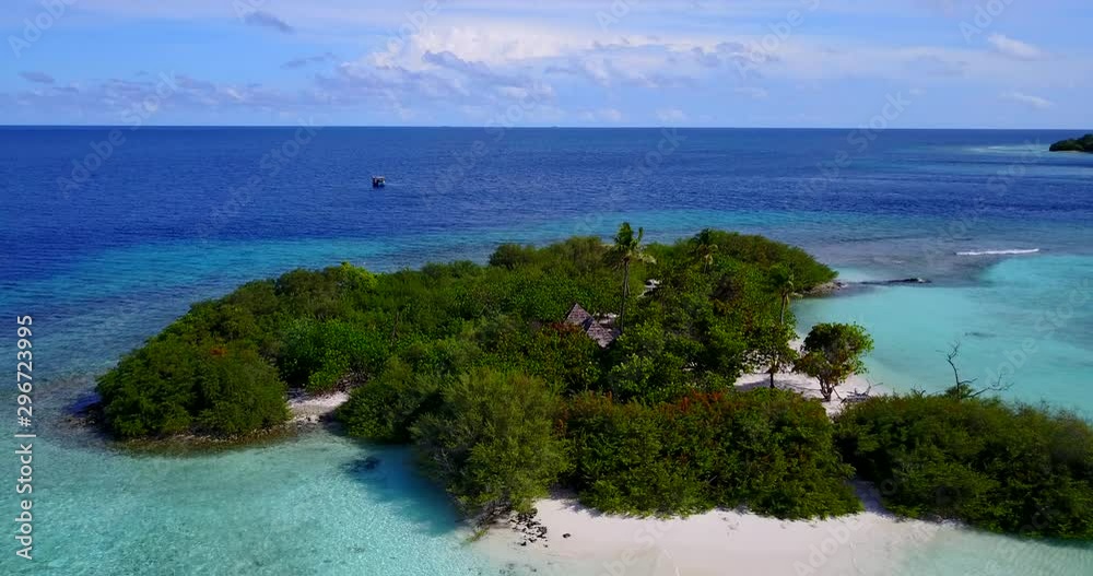 Drone flying above an exotic small island with green vegetation and a hut in the middle, with sandy white beaches and some clouds on the distance in Thailand 4K Drone flying above an exotic small island with green vegetation and a hut in the middle, with sandy white beaches and some clouds on the distance in Thailand 4K