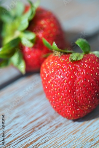 fresh wild strawberries on wooden table