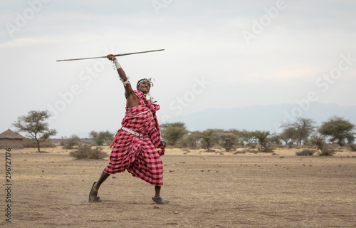 maasai men practicing throwing a spear