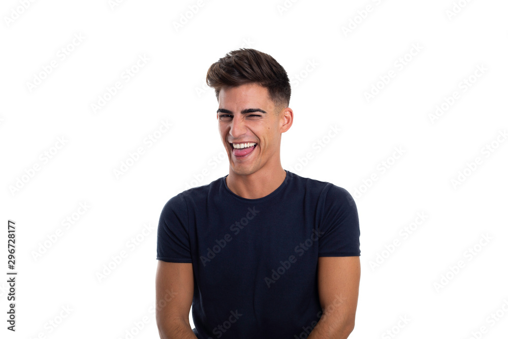 Handsome young man laughing in a photo studio Handsome young man laughing in a photo studio