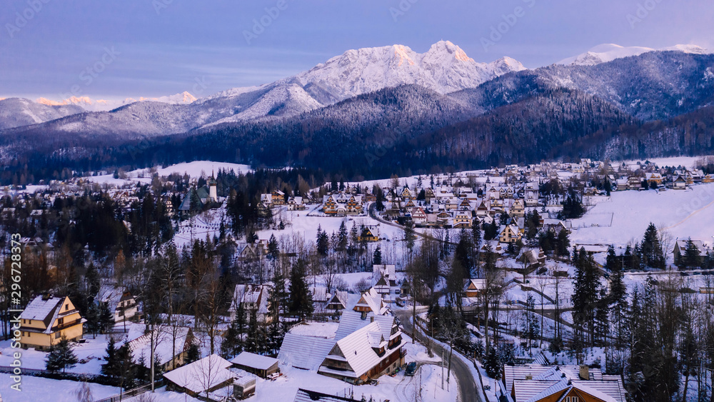 Aerial landscape with tatra mountains and Zakopane, winter scenery of Giewont Peak.