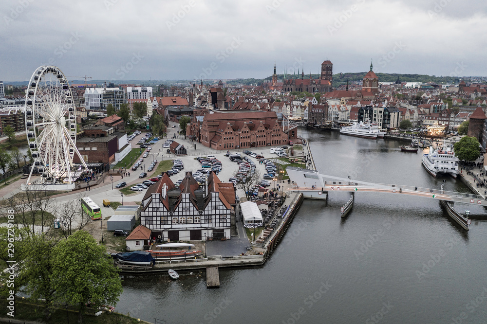 Fototapeta premium Aerial view on Motlawa river in Gdansk with amber sky wheel.