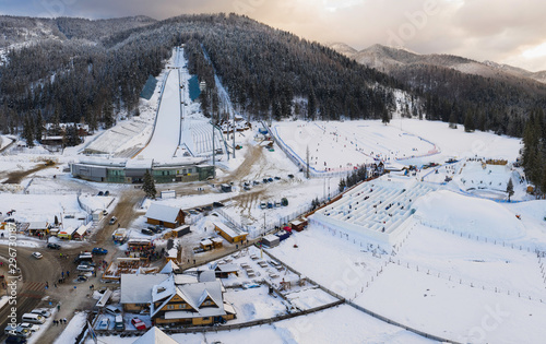 Large ski jump in Zakopane called Huge Krokiew names Stanislawa Marusarza, winter aerial view.