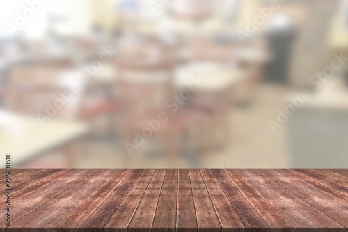 Wooden table with blur restaurant background © sirawut