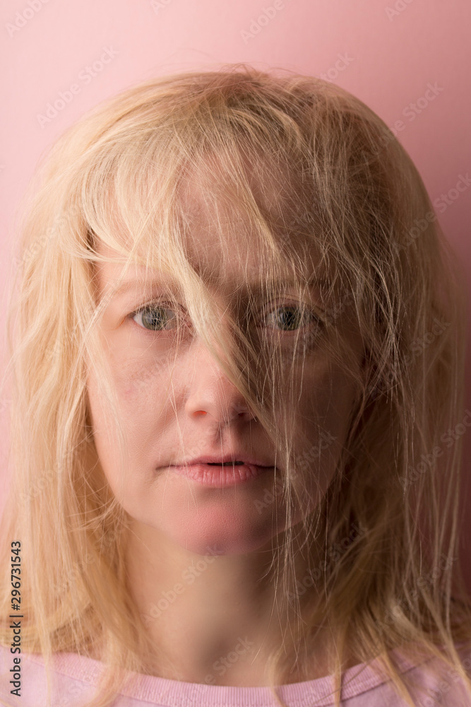 Portrait of the beautiful young woman with magnificent light hair, bangs on the face. close up. Portrait of the beautiful young woman with magnificent light hair, bangs on the face. close up.