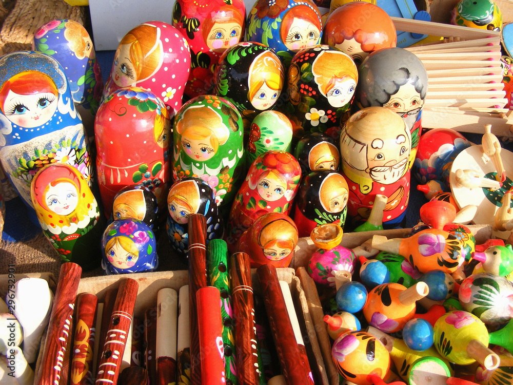 Colorful russian wooden nesting dolls are displayed at a market Colorful russian wooden nesting dolls are displayed at a market