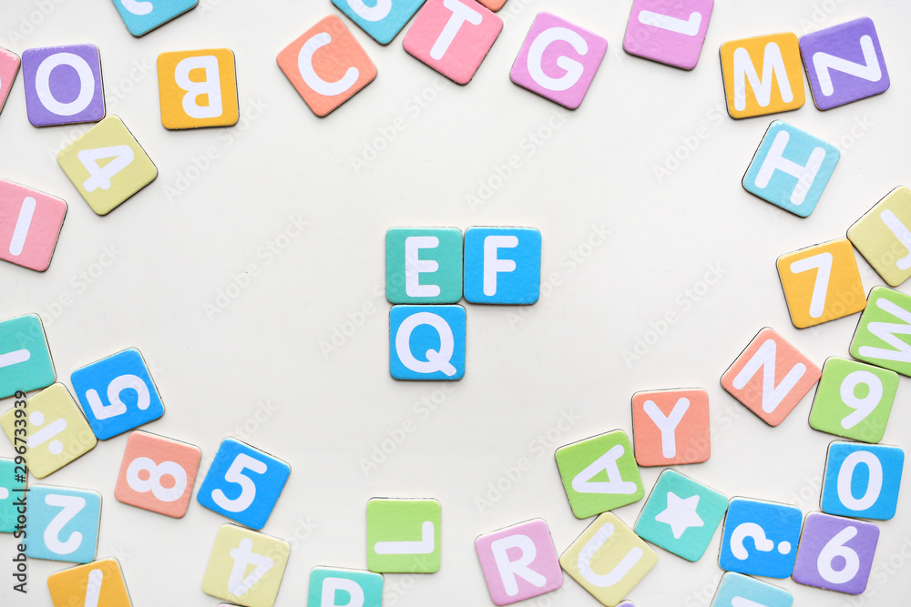 Multi-color Alphabet ABC letters and number and mathematics sign in square flat papers on white background with EF and EQ at center. Multi-color Alphabet ABC letters and number and mathematics sign in square flat papers on white background with EF and EQ at center.