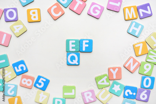 Multi-color Alphabet ABC letters and number and mathematics sign in square flat papers on white background with EF and EQ at center.