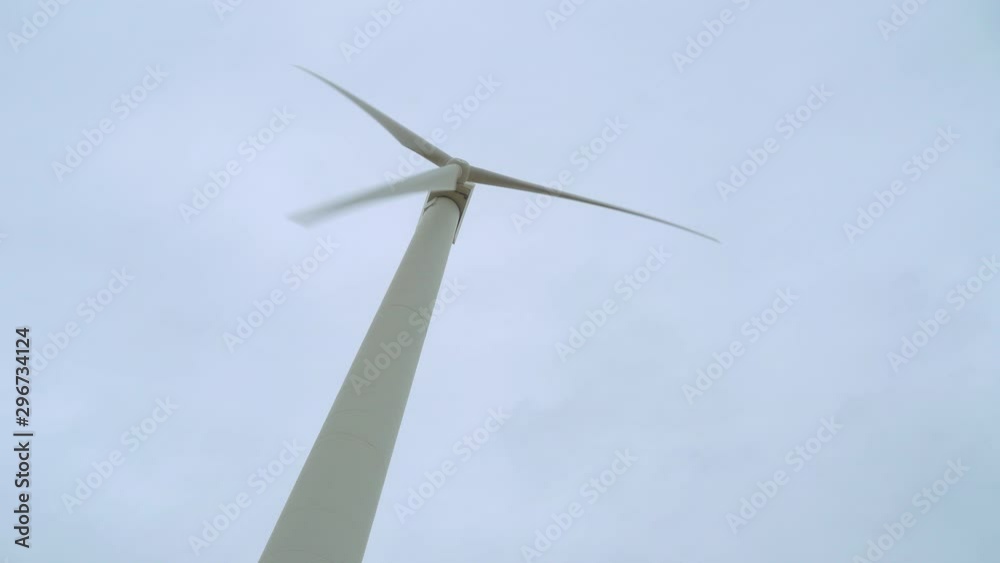Wind turbine, low angle rotating view from below.