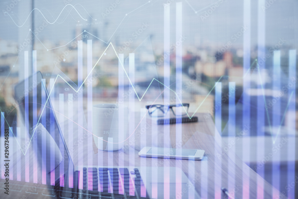Forex Chart hologram on table with computer background. Multi exposure. Concept of financial markets. Forex Chart hologram on table with computer background. Multi exposure. Concept of financial markets.