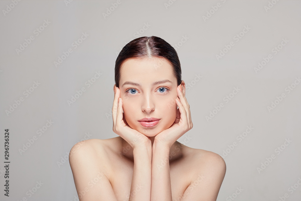 Beauty face. Beautiful woman with natural makeup touch her own face by both hands. Girl with clean fresh skin. Closeup. Cosmetology. Skincare. Beauty face. Beautiful woman with natural makeup touch her own face by both hands. Girl with clean fresh skin. Closeup. Cosmetology. Skincare.