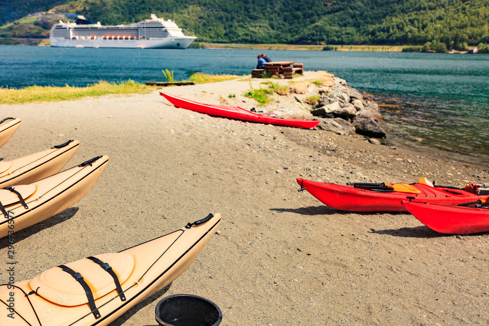 Kayaks and cruise ship in Flam, Norway Kayaks and cruise ship in Flam, Norway