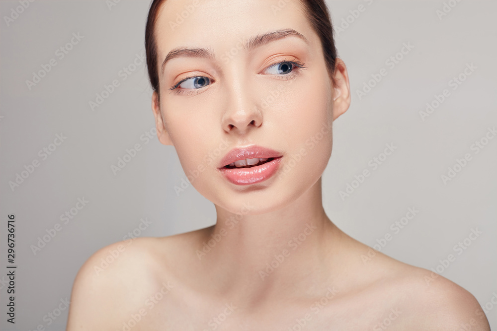 Beautiful young woman with clean fresh skin looking side. Cosmetology, beauty and spa. Face care.