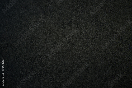 black artificial leather with waves and folds on PVC base